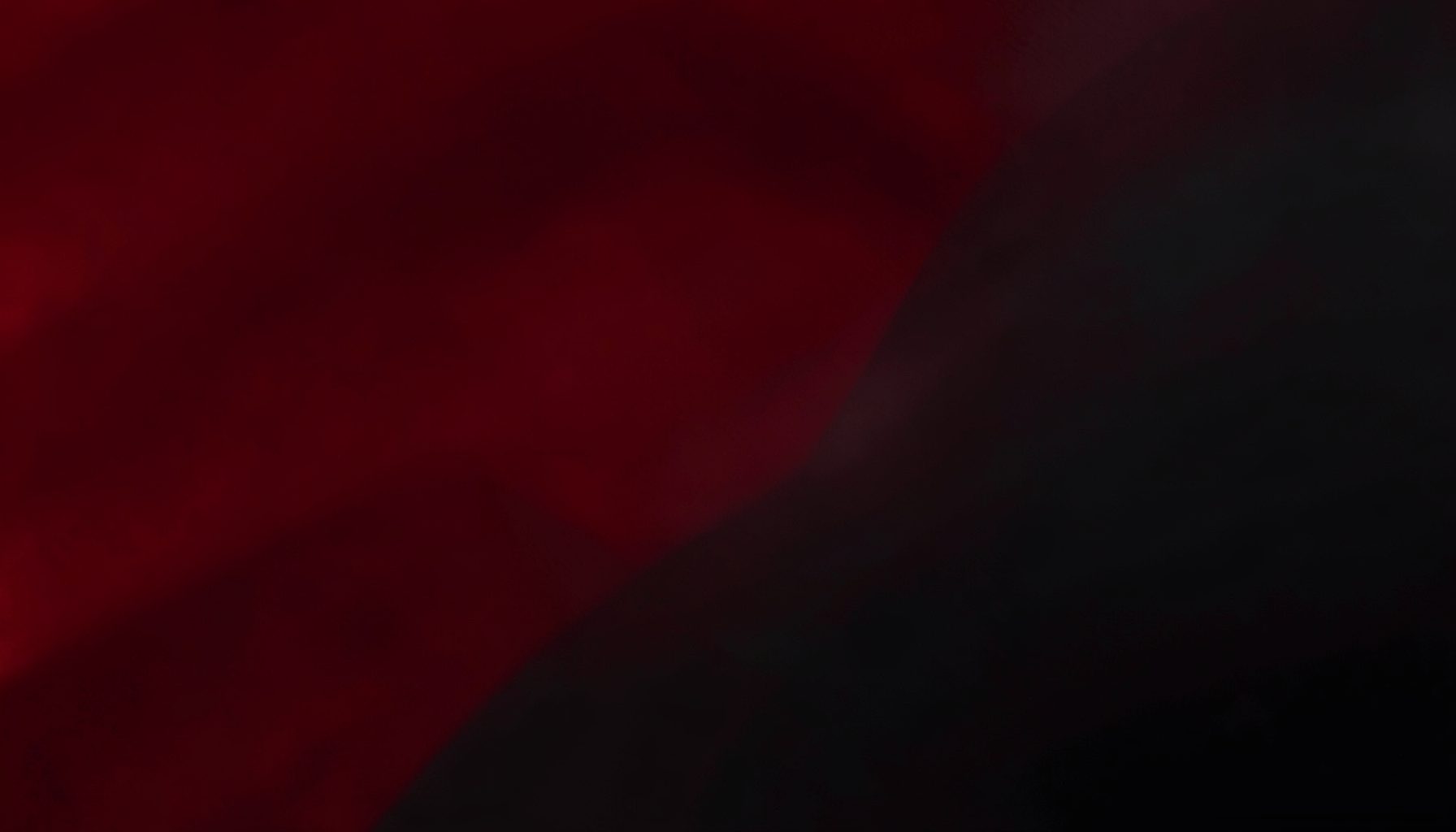 Rich crimson and charcoal abstract tones conveying passionate romantic energy